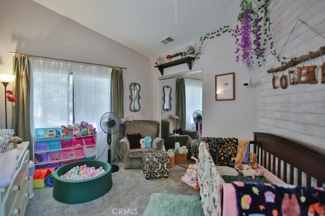 bedroom featuring lofted ceiling, a closet, carpet flooring, and visible vents