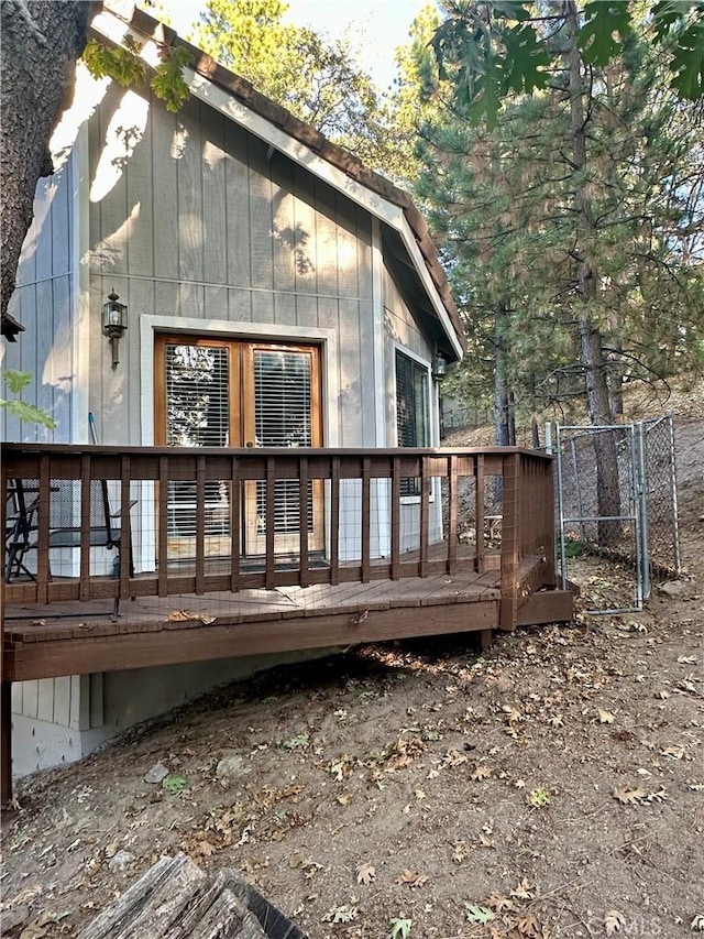 rear view of property featuring a deck