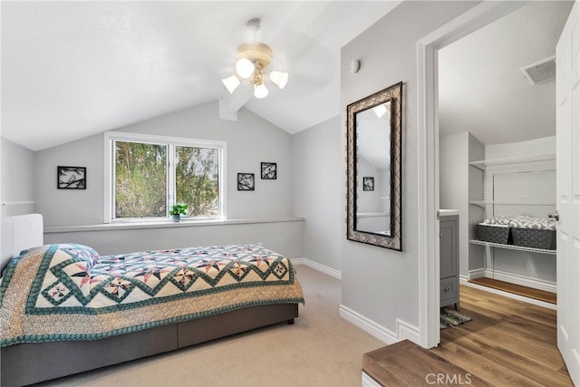 bedroom featuring lofted ceiling, hardwood / wood-style flooring, and ceiling fan