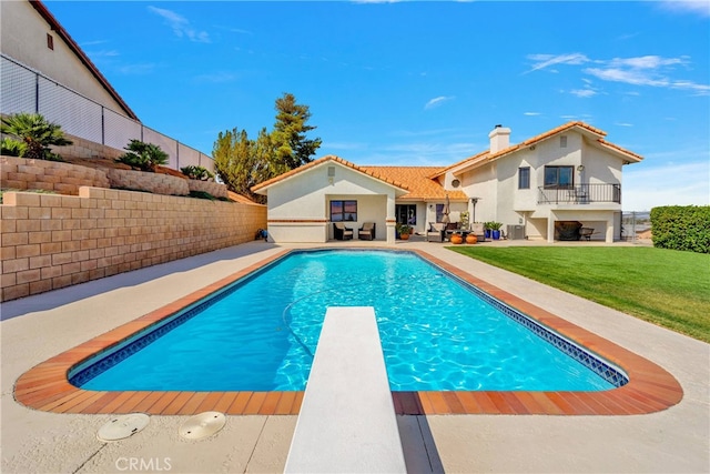 view of pool featuring a patio area, central AC, a diving board, and a lawn