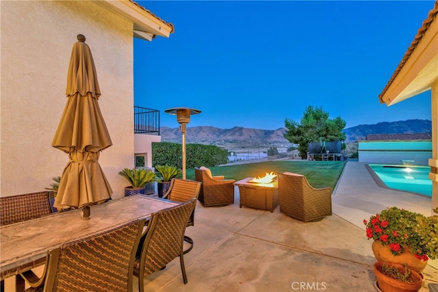 view of patio / terrace with a mountain view and a balcony