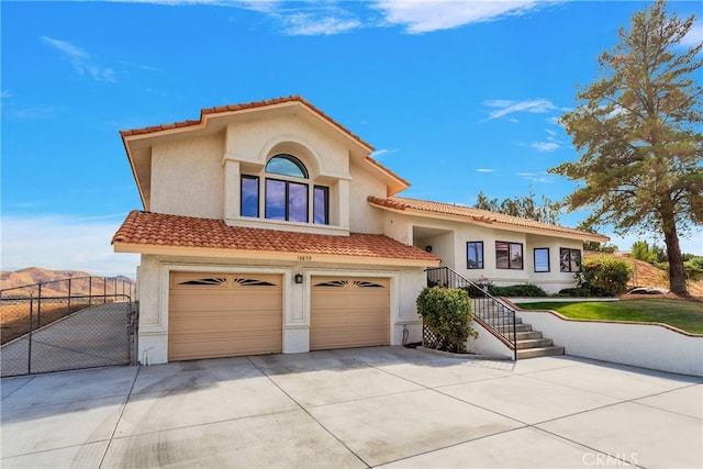 mediterranean / spanish-style house featuring a garage