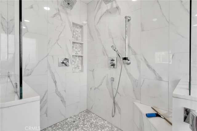 bathroom with a tile shower