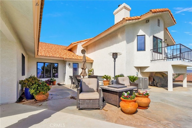 view of patio / terrace with central AC unit