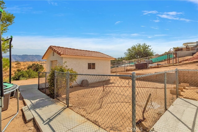 view of property exterior featuring a mountain view