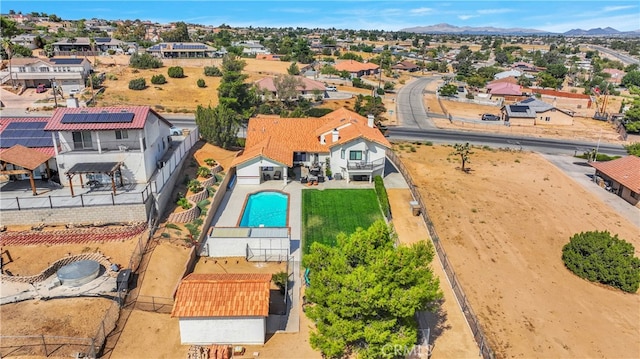 birds eye view of property with a mountain view