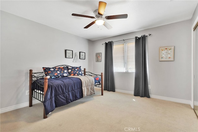 bedroom featuring ceiling fan and light colored carpet