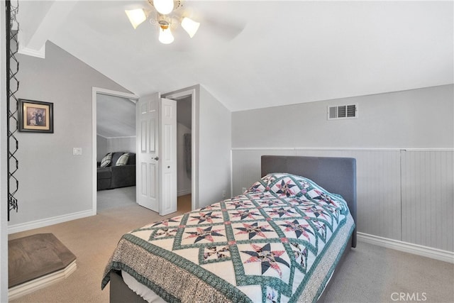 bedroom featuring lofted ceiling, ceiling fan, and carpet flooring