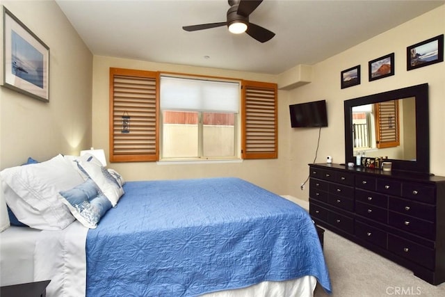 carpeted bedroom featuring a ceiling fan