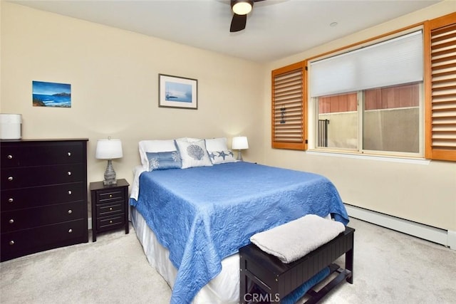 carpeted bedroom with a ceiling fan and baseboard heating