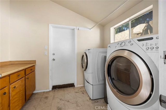 clothes washing area featuring washing machine and dryer