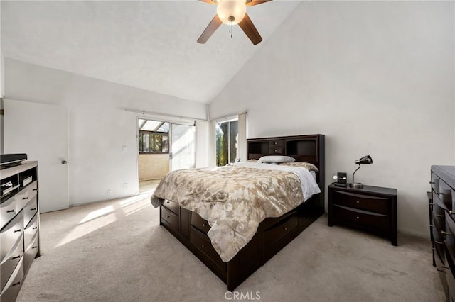 carpeted bedroom featuring high vaulted ceiling and ceiling fan