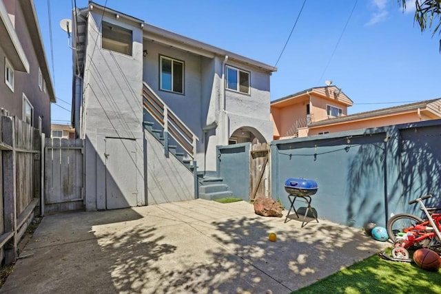 rear view of house with a patio area