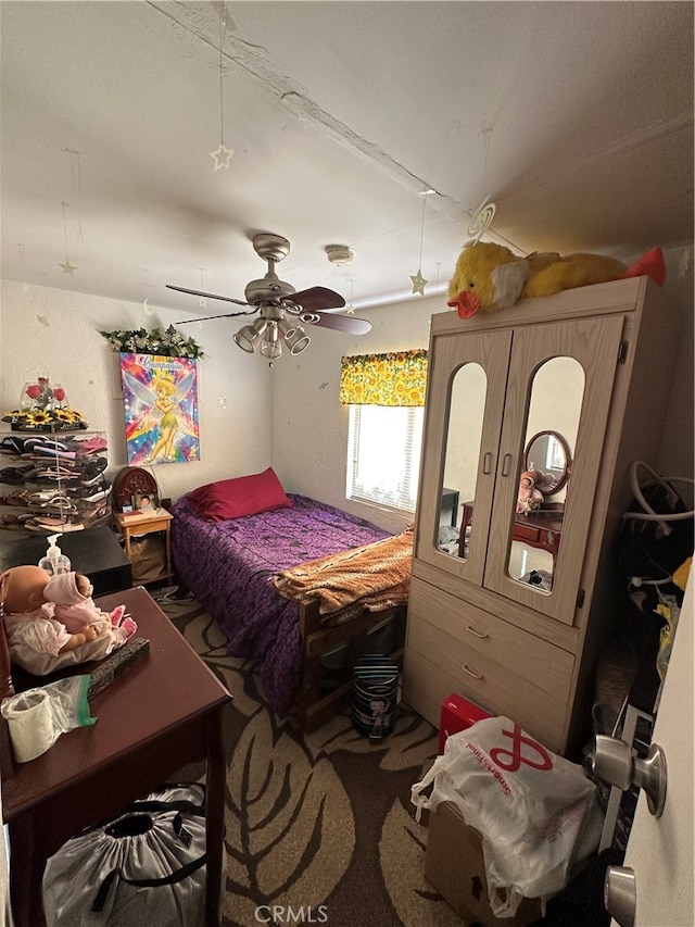 bedroom featuring ceiling fan