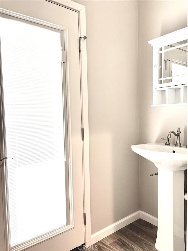 bathroom with hardwood / wood-style flooring