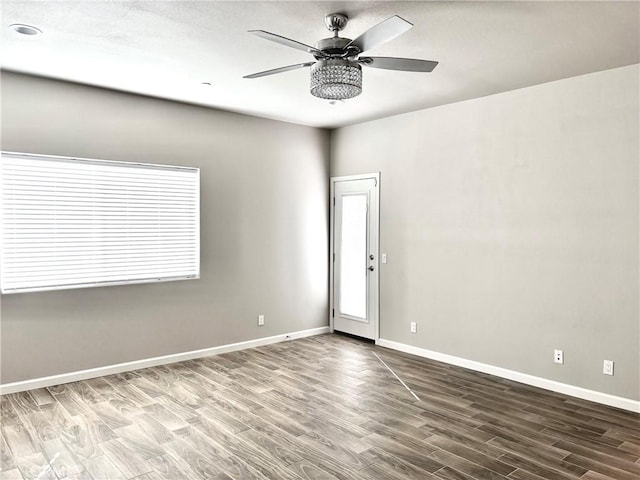 spare room featuring hardwood / wood-style flooring and ceiling fan