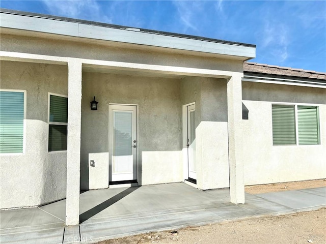 doorway to property featuring a patio