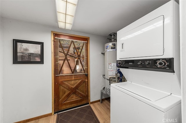 clothes washing area with secured water heater, stacked washer / drying machine, and light hardwood / wood-style floors