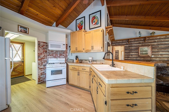 kitchen featuring white appliances, sink, wooden ceiling, light hardwood / wood-style flooring, and vaulted ceiling with beams