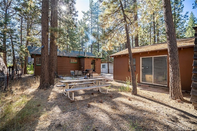 rear view of property featuring a patio area