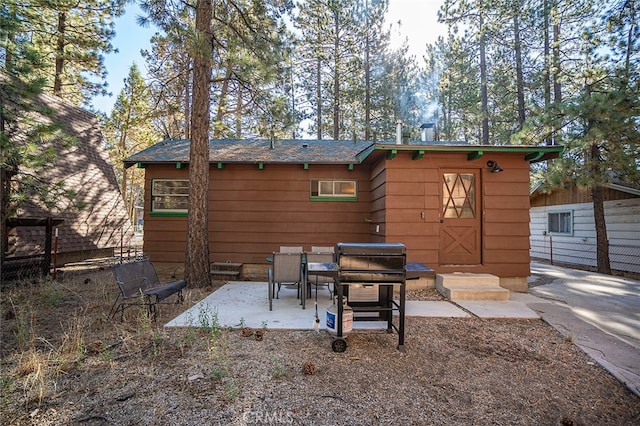 rear view of property featuring a patio area