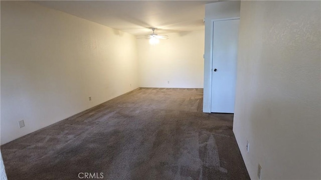 carpeted empty room with ceiling fan