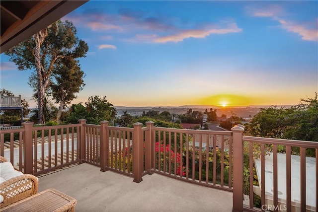 view of balcony at dusk