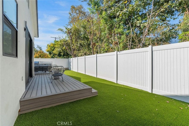 view of yard featuring a wooden deck