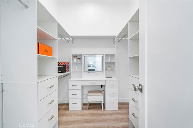 walk in closet featuring light hardwood / wood-style flooring