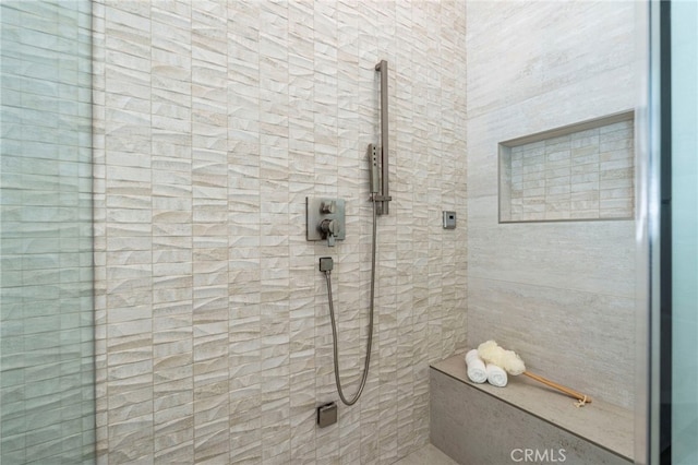 bathroom featuring tiled shower