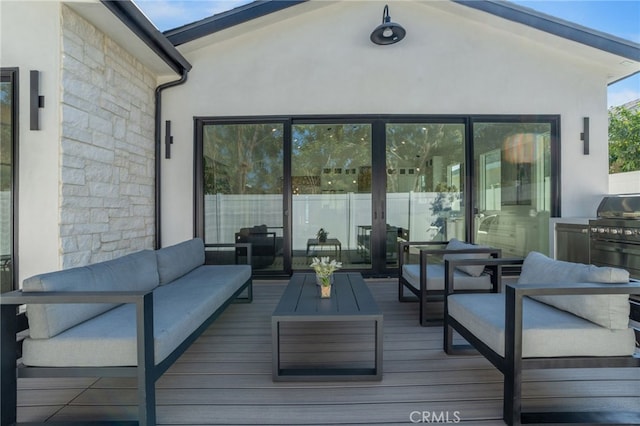 wooden terrace with outdoor lounge area