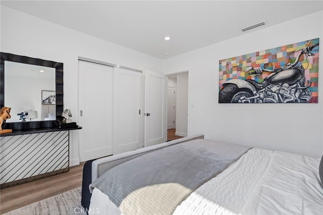 bedroom featuring a closet and hardwood / wood-style flooring