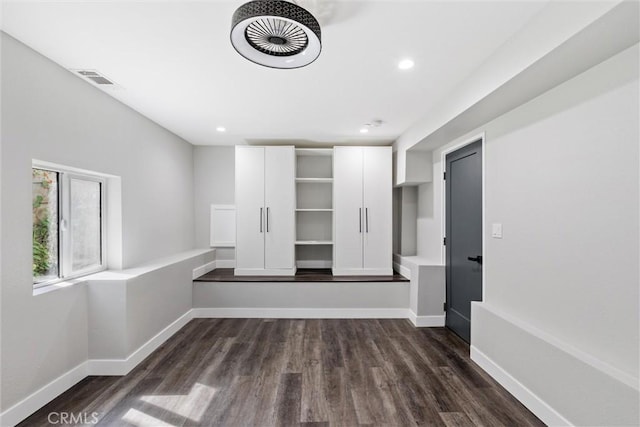 interior space with dark hardwood / wood-style floors