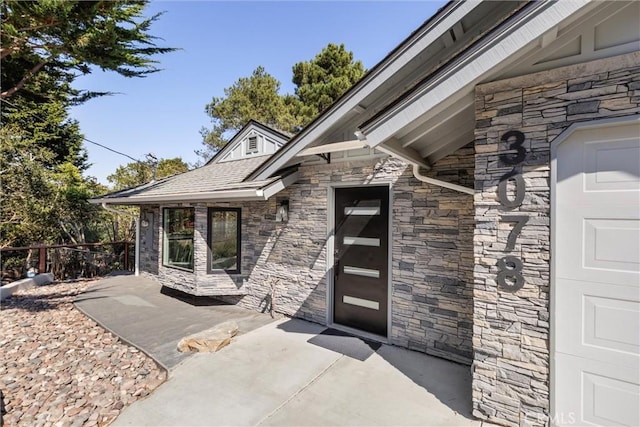 3078 Wilton Dr, Cambria, CA 93428 - doorway to property with stone siding and a patio area