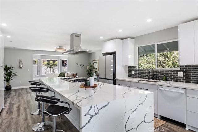 3078 Wilton Dr, Cambria, CA 93428 - kitchen with island exhaust hood, white dishwasher, freestanding refrigerator, modern cabinets, and a kitchen island