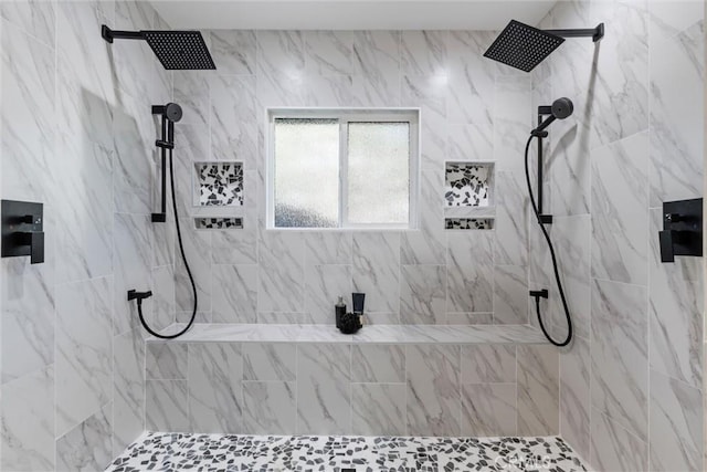 bathroom featuring a tile shower