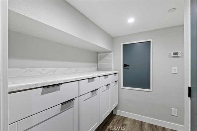 3078 Wilton Dr, Cambria, CA 93428 - kitchen with dark wood finished floors, white cabinetry, and light stone counters