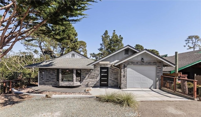 3078 Wilton Dr, Cambria, CA 93428 - view of front of house featuring an attached garage, concrete driveway, board and batten siding, and stone siding