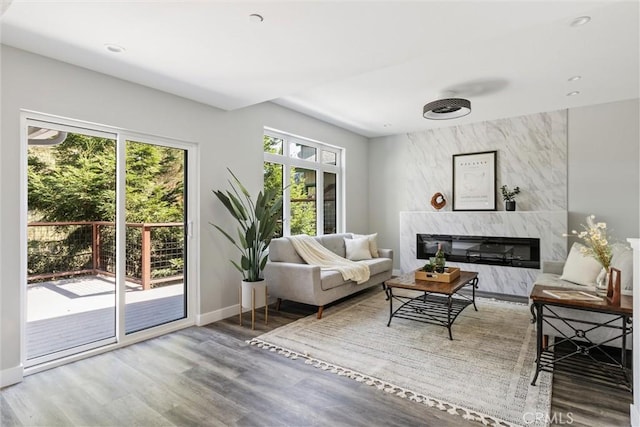 3078 Wilton Dr, Cambria, CA 93428 - living area featuring wood finished floors, a high end fireplace, and recessed lighting