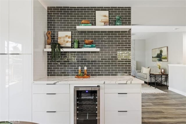 3078 Wilton Dr, Cambria, CA 93428 - bar with wine cooler, wood finished floors, and tasteful backsplash