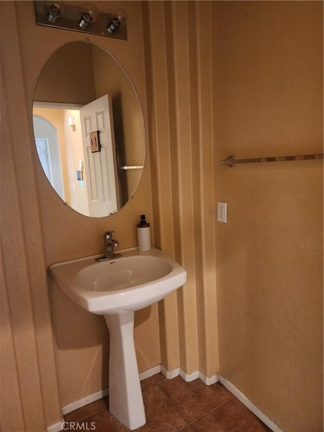 bathroom with tile patterned floors and sink