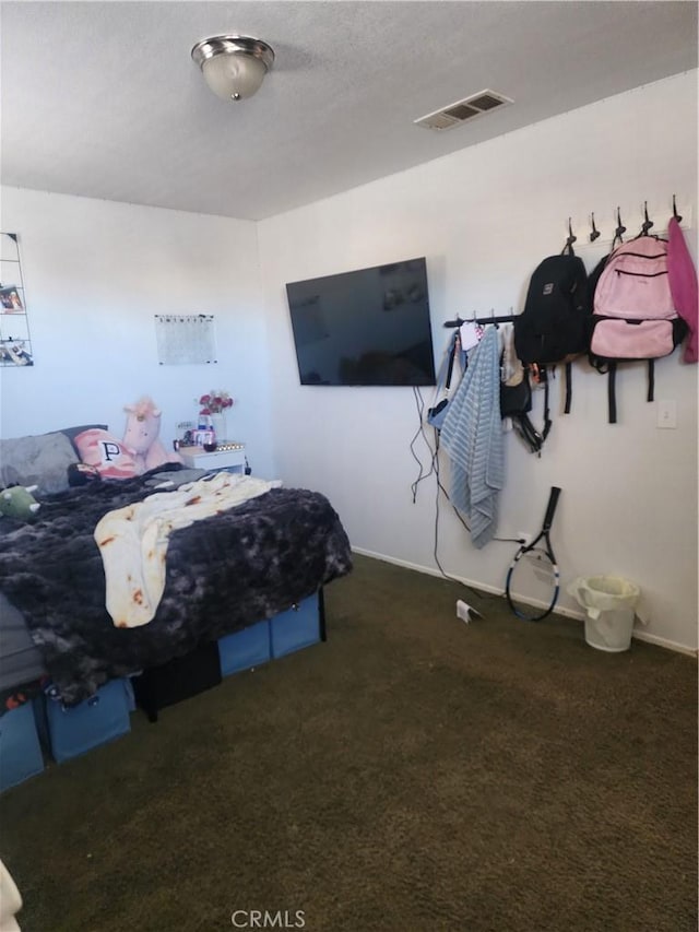 bedroom featuring dark colored carpet