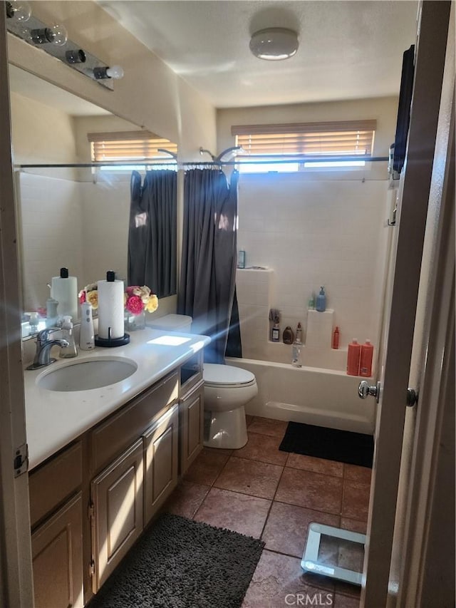 full bathroom featuring tile patterned floors, vanity, bathtub / shower combination, and toilet