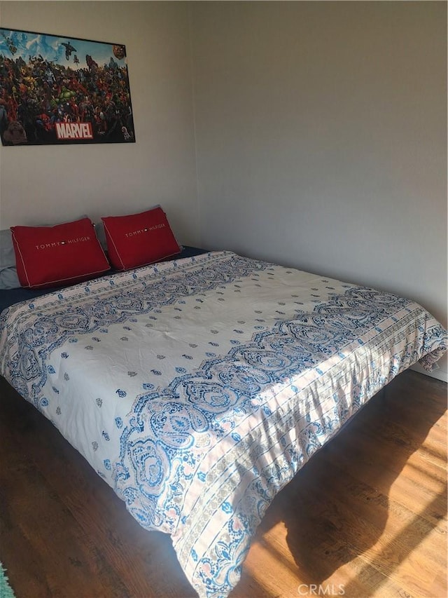 bedroom with wood-type flooring