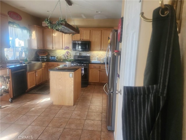 kitchen featuring light tile patterned flooring, backsplash, black appliances, light brown cabinetry, and a kitchen island