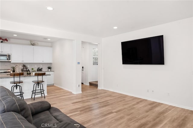 living room with light hardwood / wood-style floors