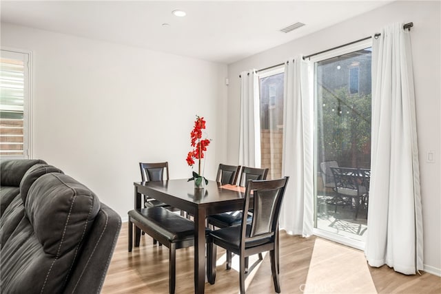 dining room featuring light hardwood / wood-style flooring