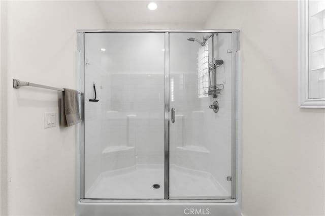 bathroom featuring an enclosed shower