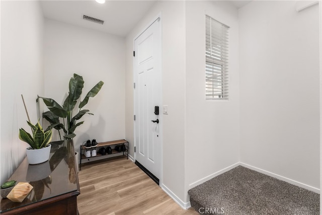 doorway to outside with light hardwood / wood-style flooring