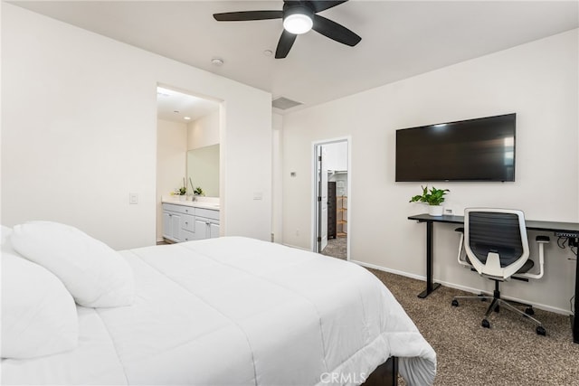 carpeted bedroom featuring ensuite bath and ceiling fan